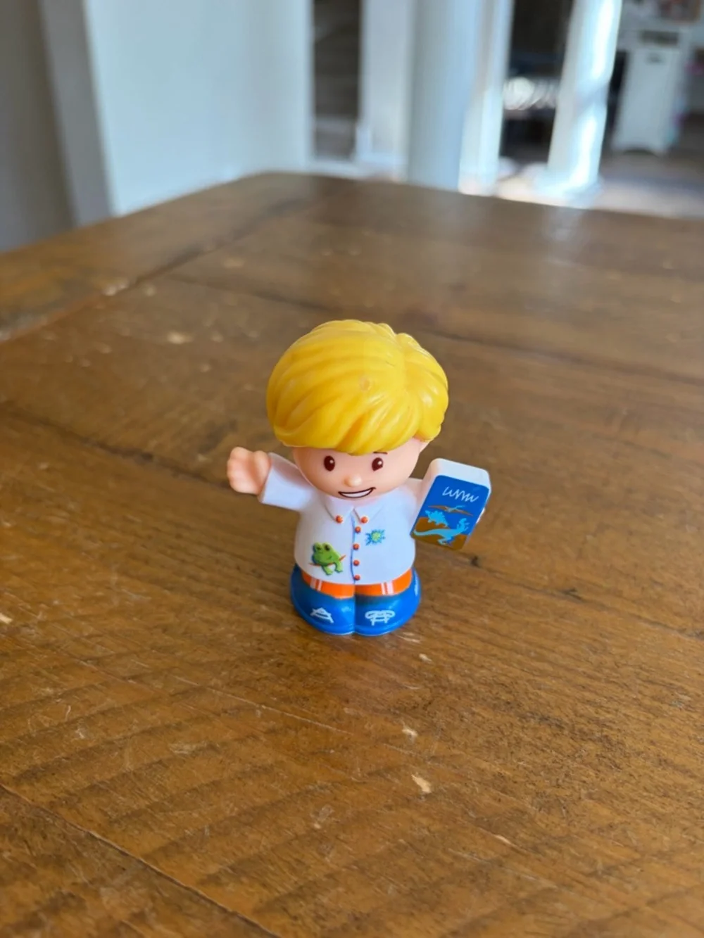 Fisher Price Little People Eddie with dinosaur book as is